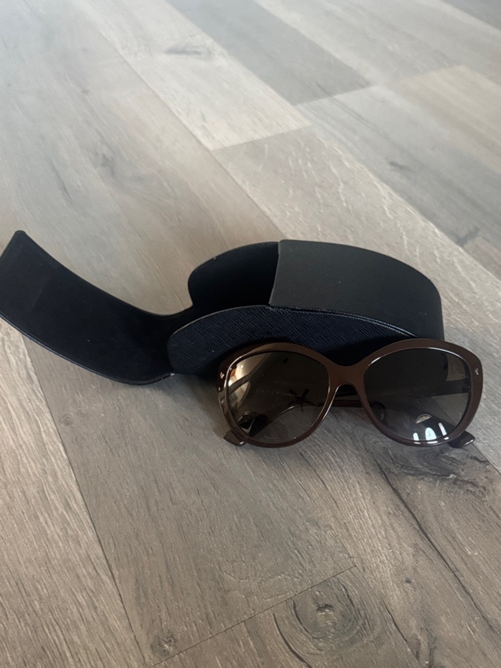 Prada Brown Women's Oval Sunglasses with Dark Brown Lenses